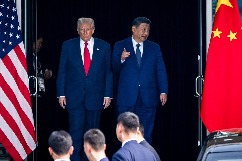 (Haiyun Jiang | The New York Times) President Donald Trump and Xi Jinping, China's top leader, exit together after their meeting in Busan, South Korea, on Thursday, Oct. 30, 2025.
