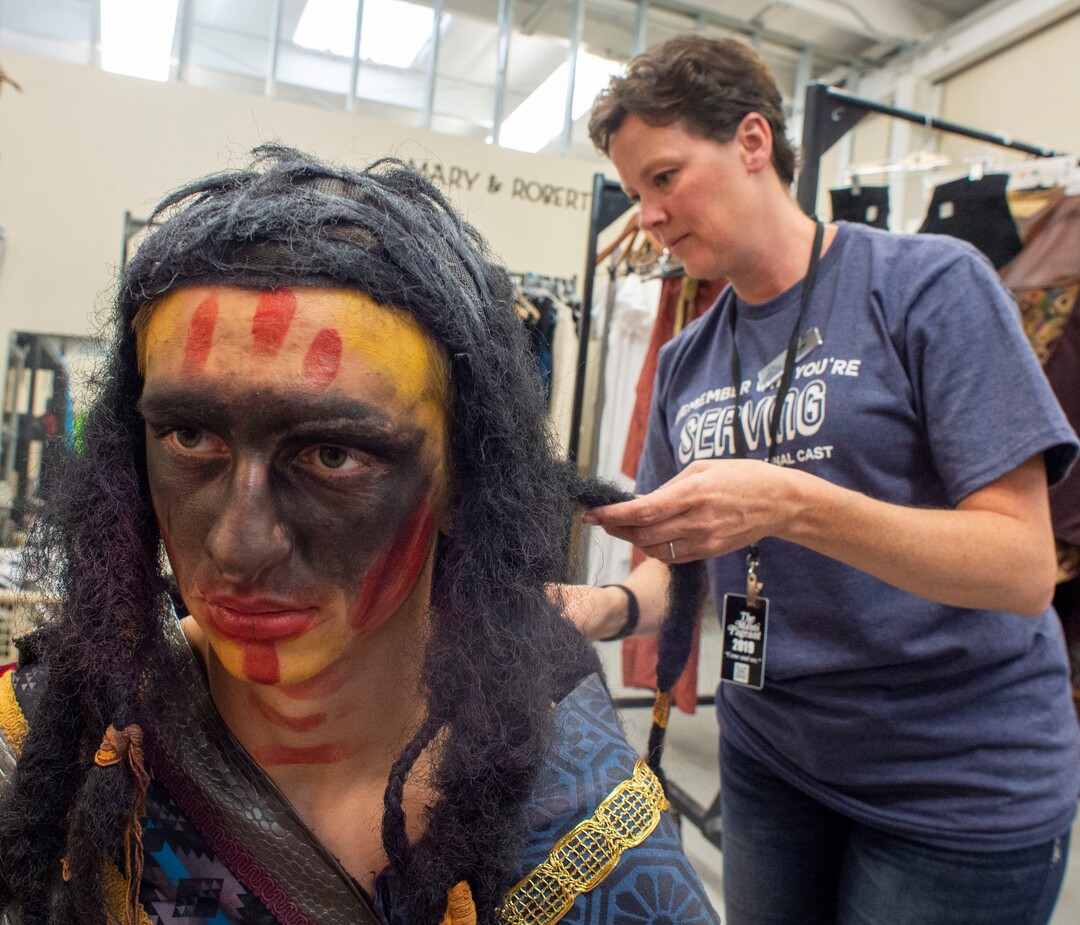(Rick Egan  |  The Salt Lake Tribune)    Trevor Steck, in costume as Lamanite commander Zerahemnah, prepares for his role with costume builder, Angela Rosequist  before start of the Mormon Miracle Pageant, Wednesday, June 12, 2019.  The final run for the pageant continues through Saturday, June 22.