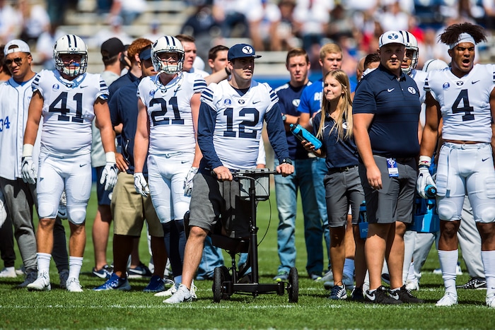 (Chris Detrick  |  The Salt Lake Tribune)   Brigham Young Cougars quarterback Tanner Mangum (12) watches practice before the game at LaVell Edwards Stadium Saturday Saturday, September 16, 2017. 