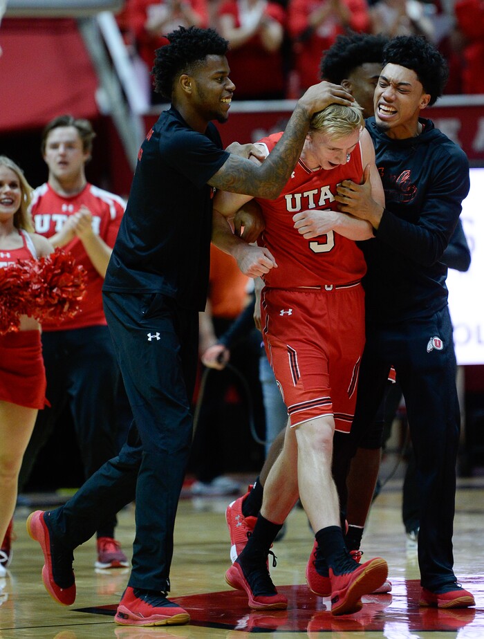 (Francisco Kjolseth  |  The Salt Lake Tribune)  Utah Utes guard Parker Van Dyke (5) is celebrated by his team after playing a critical role in their win over UCLA at the Huntsman Center in Salt Lake City, Thursday, Feb. 22, 2018.