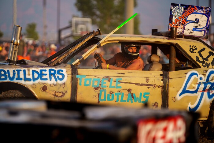 (Trent Nelson  |  The Salt Lake Tribune) Zeb Hansen behind the wheel during Punishment at the Peak, a demolition derby in Grantsville on Saturday, Aug. 7, 2021.