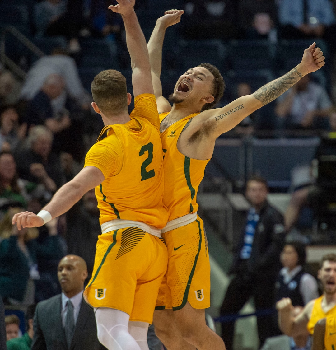 (Rick Egan  |  The Salt Lake Tribune)  San Francisco Dons guard Frankie Ferrari (2) AND San Francisco Dons guard Trevante Anderson (12) celebrate  San Francisco Dons 77-71 win over BYU, in WCC basketball action at the Marriott Center, Thursday, February 21, 2018.