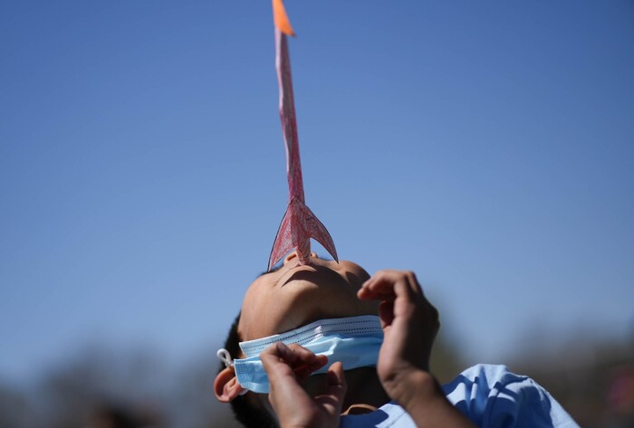 (Francisco Kjolseth | The Salt Lake Tribune) Mary W. Jackson Elementary first grader Isaiah Kam, 7, launches his straw rocket as students commemorate their school’s namesake’s 100th birthday on Friday, April 9, 2021, with a special science lesson in the mechanics of rocket building. Salt Lake City’s oldest elementary school was renamed in 2018 in honor of the the first African American female engineer at NASA, with students recently voting to change their mascot to “The Rockets.”
