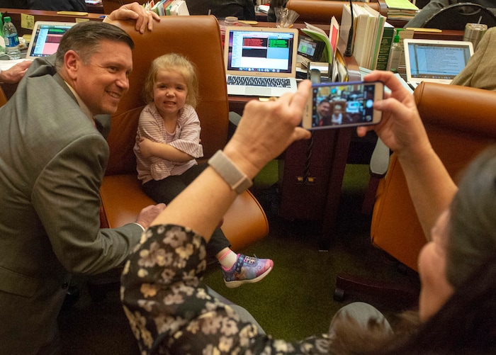 (Rick Egan  |  The Salt Lake Tribune)  Ann Peterson snaps a photo of her husband, Rep. Val Peterson, and their grand daughter, 3-year-old Evelyn Wagner, on the final day of the 2019 legislature, Thursday, March 14, 2019. 


