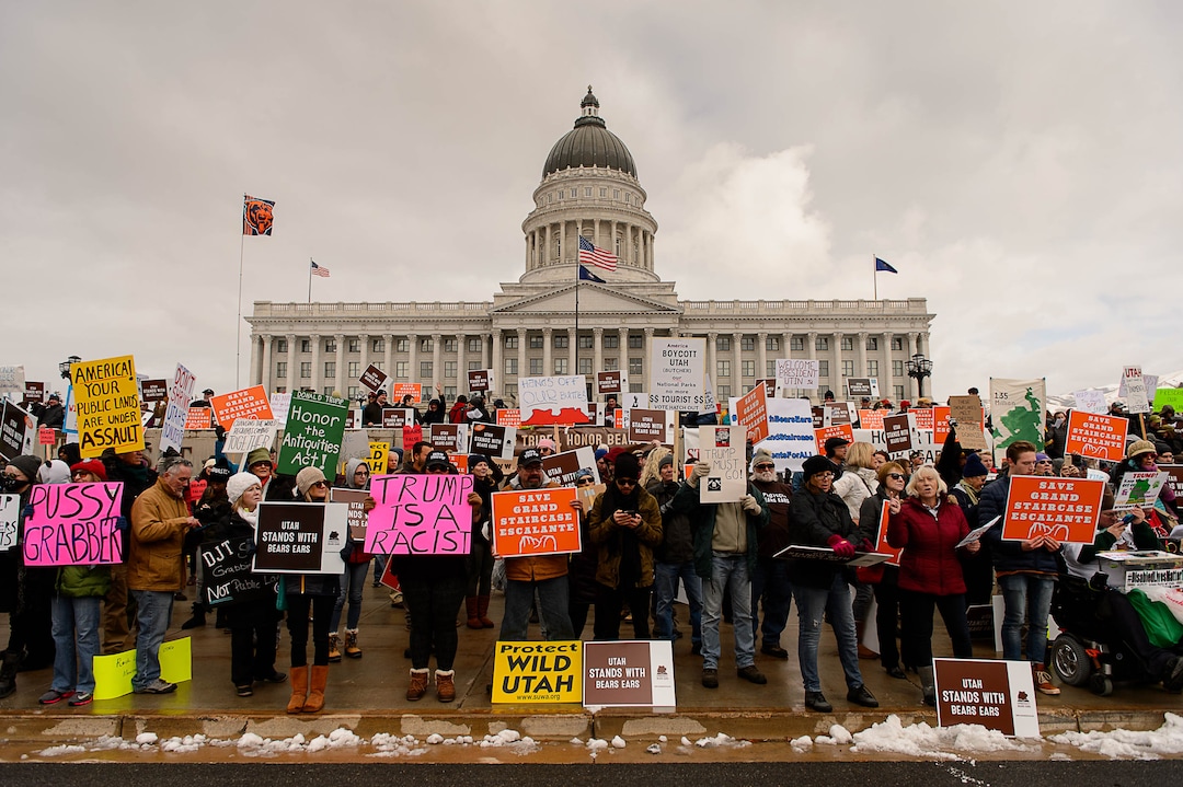 (Trent Nelson | The Salt Lake Tribune)  Protesters gather before a visit by President Donald Trump, Monday December 4, 2017.