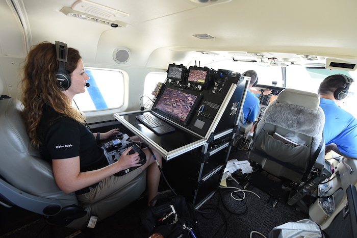 (Francisco Kjolseth  |  The Salt Lake Tribune)  Amber Surrency, an aerial research photographer for CoStar Group Inc., documents downtown Salt Lake City on Friday, June 8, 2018, from the air of a specially equipped Cessna Grand Caravan EX. CoStar Group Inc., a research and technology company provides information to commercial real estate professionals, including those in Utah.