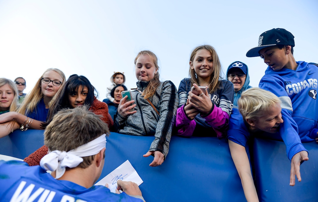 (Leah Hogsten  |  The Salt Lake Tribune) Brigham Young Cougars quarterback Zach Wilson (1) sign autographs for fans after the win. Brigham Young University defeated  Idaho State 41-10, Saturday, Nov. 16, 2019 at LaVell Edwards Stadium.