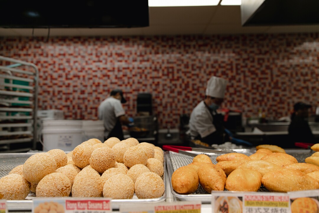 (Rachel Rydalch | The Salt Lake Tribune) Bakers prepare pastries and other foods behind the bakery counter at the Chinatown Supermarket in South Salt Lake on Wednesday, March 2, 2022.