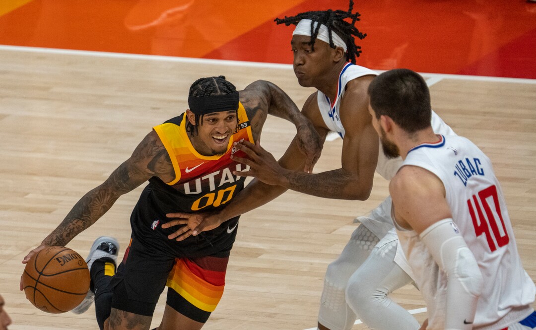 (Rick Egan | The Salt Lake Tribune) Utah Jazz guard Jordan Clarkson (00) takes the ball inside as LA Clippers guard Terance Mann (14) and LA Clippers center Ivica Zubac (40) defend, in NBA action between the Utah Jazz and the LA Clippers, in game one in the second round of the NBA playoff series at Vivint Arena, on Tuesday, June 8, 2021.