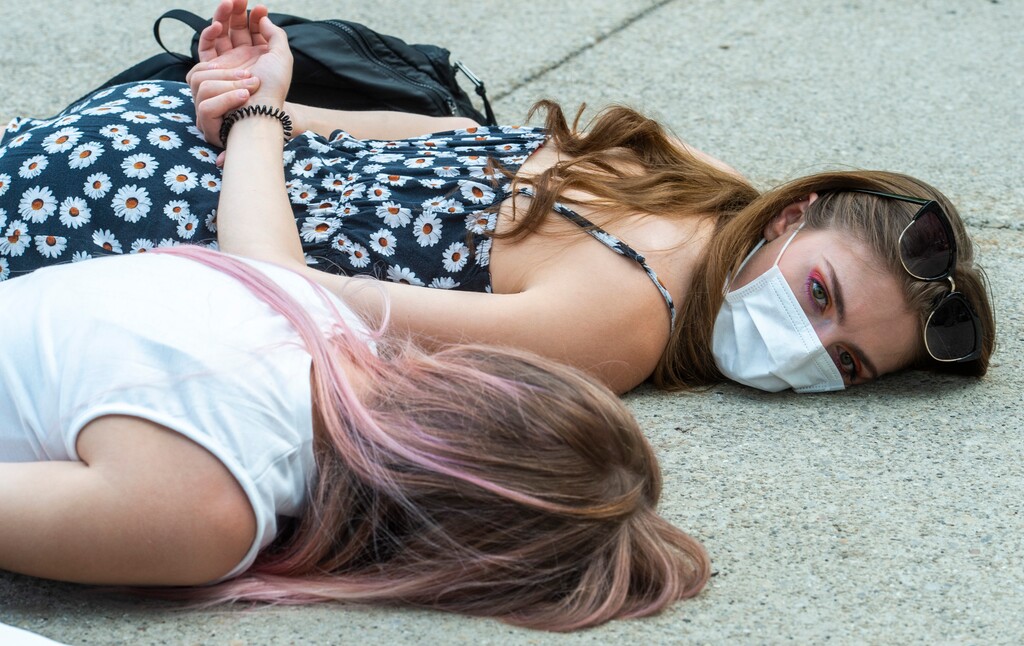 (Rick Egan  |  Tribune file photo)     Taylor Nielsen and Kirsten Leflie lie down for 8 minutes and 46 seconds in memory of George Floyd, during a demonstration at Washington Square, on Saturday, June 20, 2020.