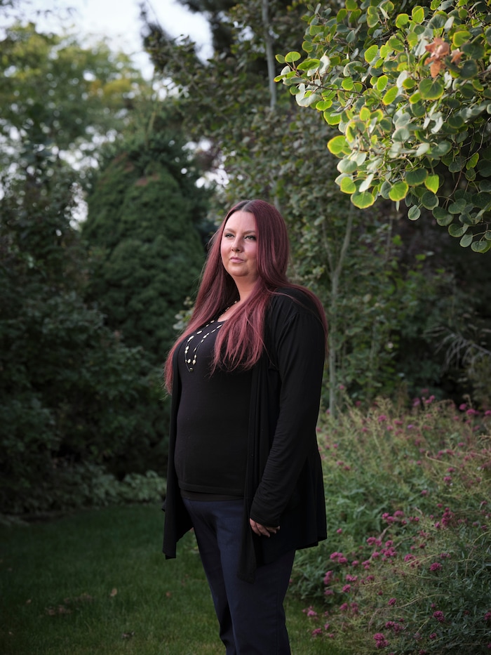 (Lindsay D'Addato | The New York Times) Jennifer Santos, who complained when her son's high school remained open despite 19 coronavirus cases, in Draper, Utah, Sept. 26, 2020. In the suburban Salt Lake City district, coronavirus cases spiked as students returned to their classrooms.