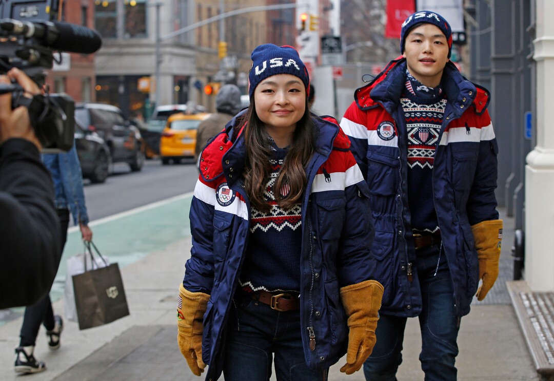 Ice dancing pair and sister and brother Maia and Alex Shibutani, who will participate in the upcoming winter Olympics in Pyeongchang, South Korea, model Team USA's opening ceremony uniforms for a cameraman on the street outside Polo Ralph Lauren's Prince Street store, Monday, Jan. 22, 2018, in New York. (AP Photo/Kathy Willens)