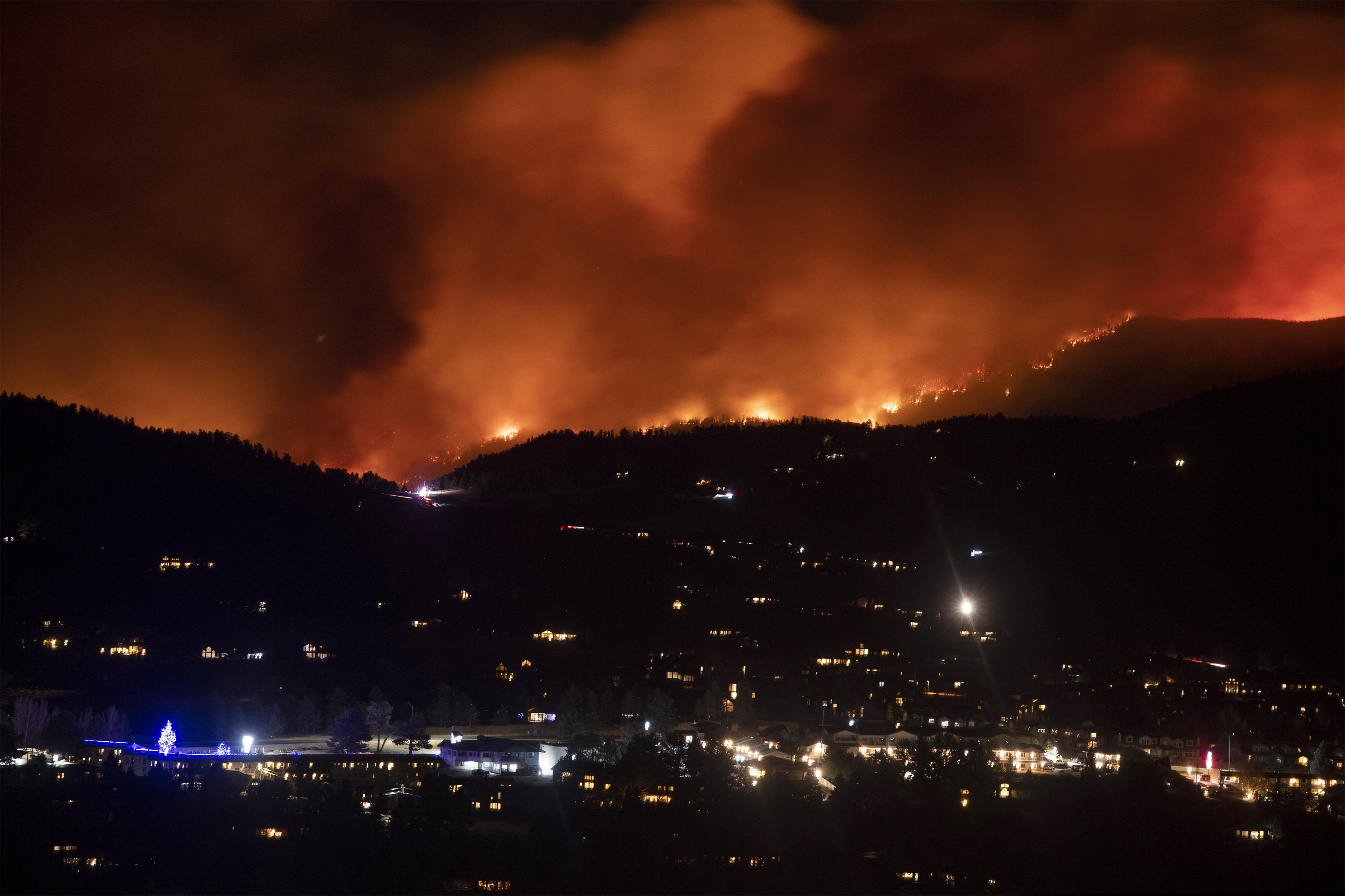 (Bethany Baker | Fort Collins Coloradoan via AP)

Flames from the Cameron Peak Fire, the largest wildfire in Colorado history, burn trees along a ridge outside Estes Park, Colo., Friday, Oct. 16, 2020.