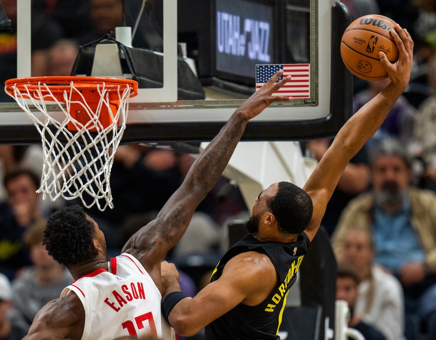 (Rick Egan | The Salt Lake Tribune) Utah Jazz guard Talen Horton-Tucker (0) dunks the ball over Houston Rockets forward Tari Eason (17), in NBA action between the Utah Jazz and the Houston Rockets, at Vivint Arena, on Wednesday, Oct. 26, 2022.