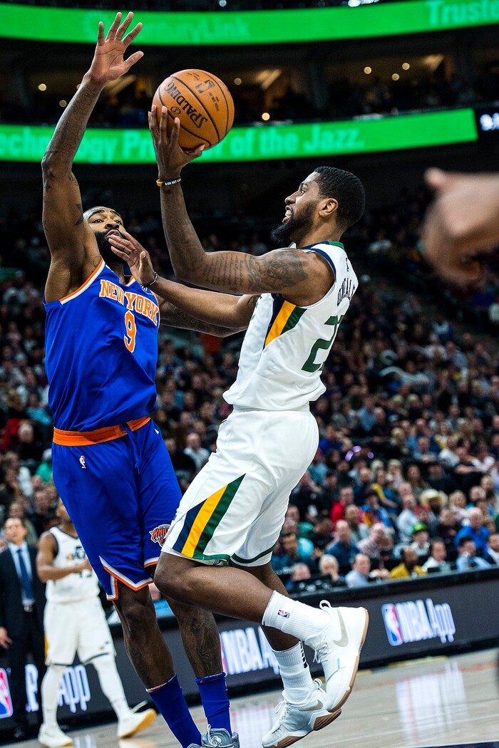 (Chris Detrick  |  The Salt Lake Tribune)  Utah Jazz forward Royce O'Neale (23) shoots past New York Knicks center Kyle O'Quinn (9) during the game at Vivint Smart Home Arena Friday, January 19, 2018.  
