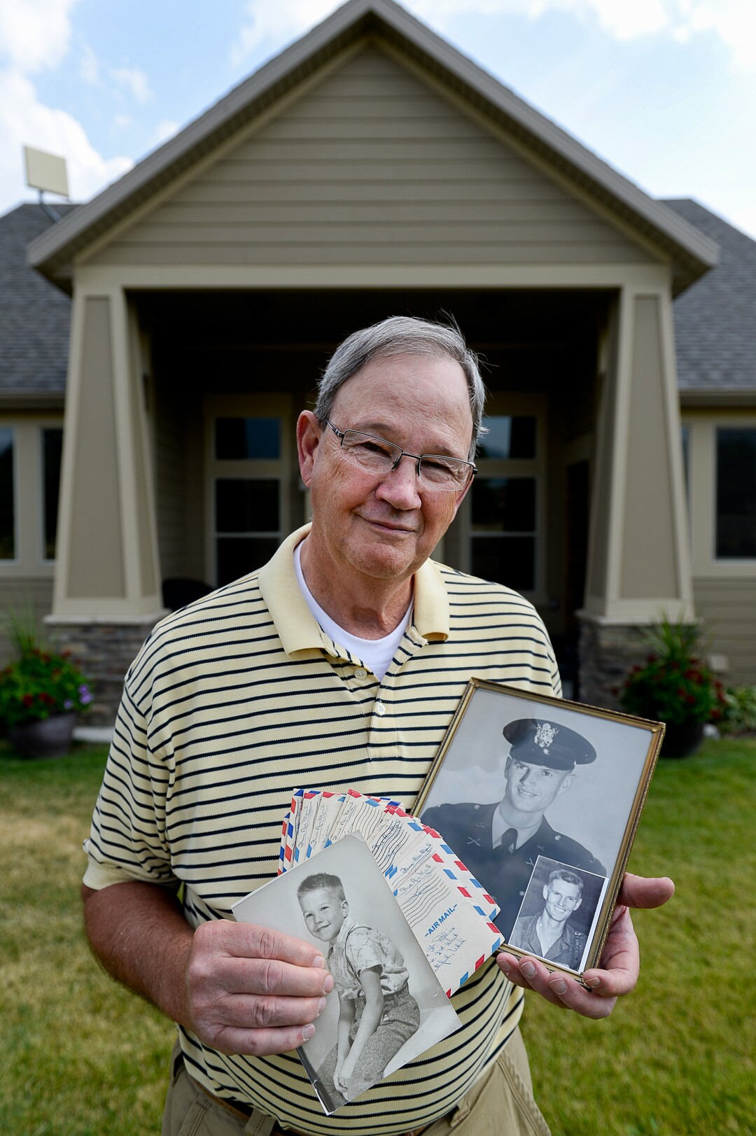 (Francisco Kjolseth  |  The Salt Lake Tribune)  Michael Bliss' father, Army 1st Lt. Clarence Bruce Bliss, went missing in action in 1952 during the Korean War when the younger Bliss was 3 years old. Now the 70-year-old resident of Midway, UT, holding photos of himself and his father along with correspondence his parents exchanged, hopes the remains the North Korean government recently provided to the United States includes his father.