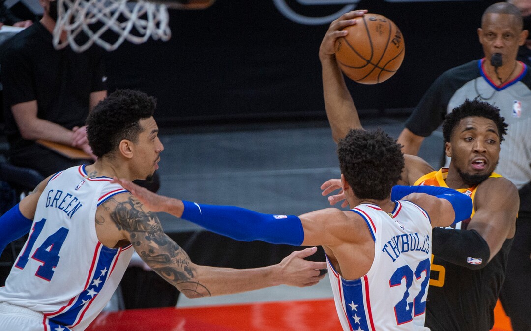 (Rick Egan | The Salt Lake Tribune) Utah guard Donovan Mitchell (45) takes the ball inside, as Philadelphia 76ers forward Danny Green (14) and Philadelphia 76ers guard Matisse Thybulle (22) defend, in NBA action between the Utah Jazz and the Philadelphia 76ers at Vivint Arena, on Monday, Feb. 15, 2021.