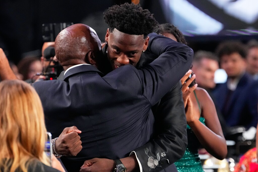 (Yuki Iwamura | AP) AJ Dybantsa, right, celebrates after being chosen by the Washington Wizards as the first pick in the first round of the NBA basketball draft, Tuesday, June 23, 2026, in New York.