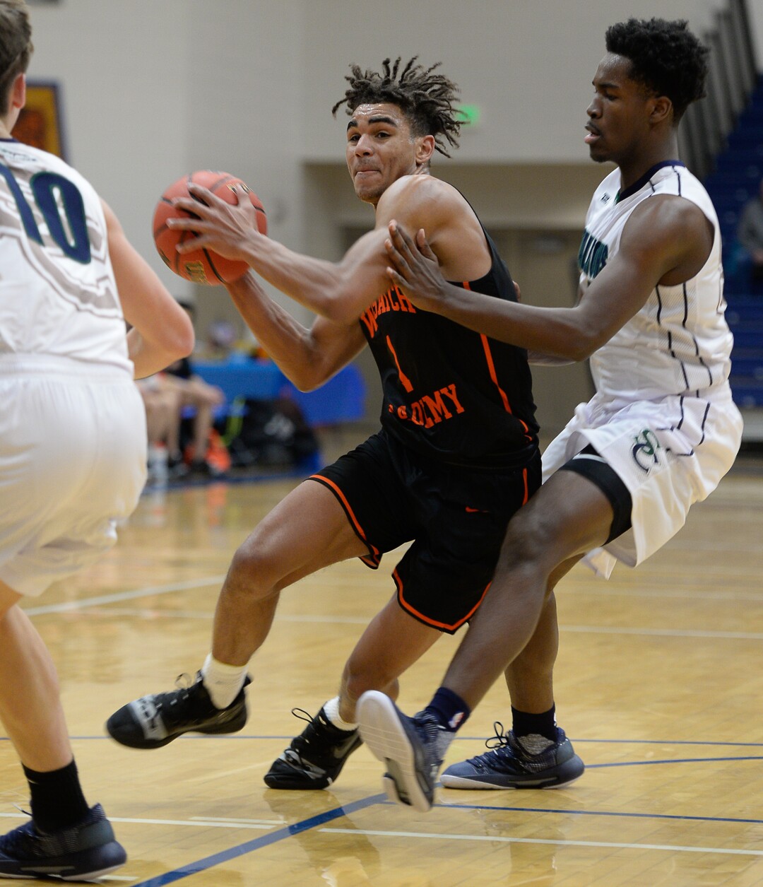 (Francisco Kjolseth  |  The Salt Lake Tribune)  Tre Williams of Wasatch Academy pushes through the South County high defense during a recent tournament at Orem High. 