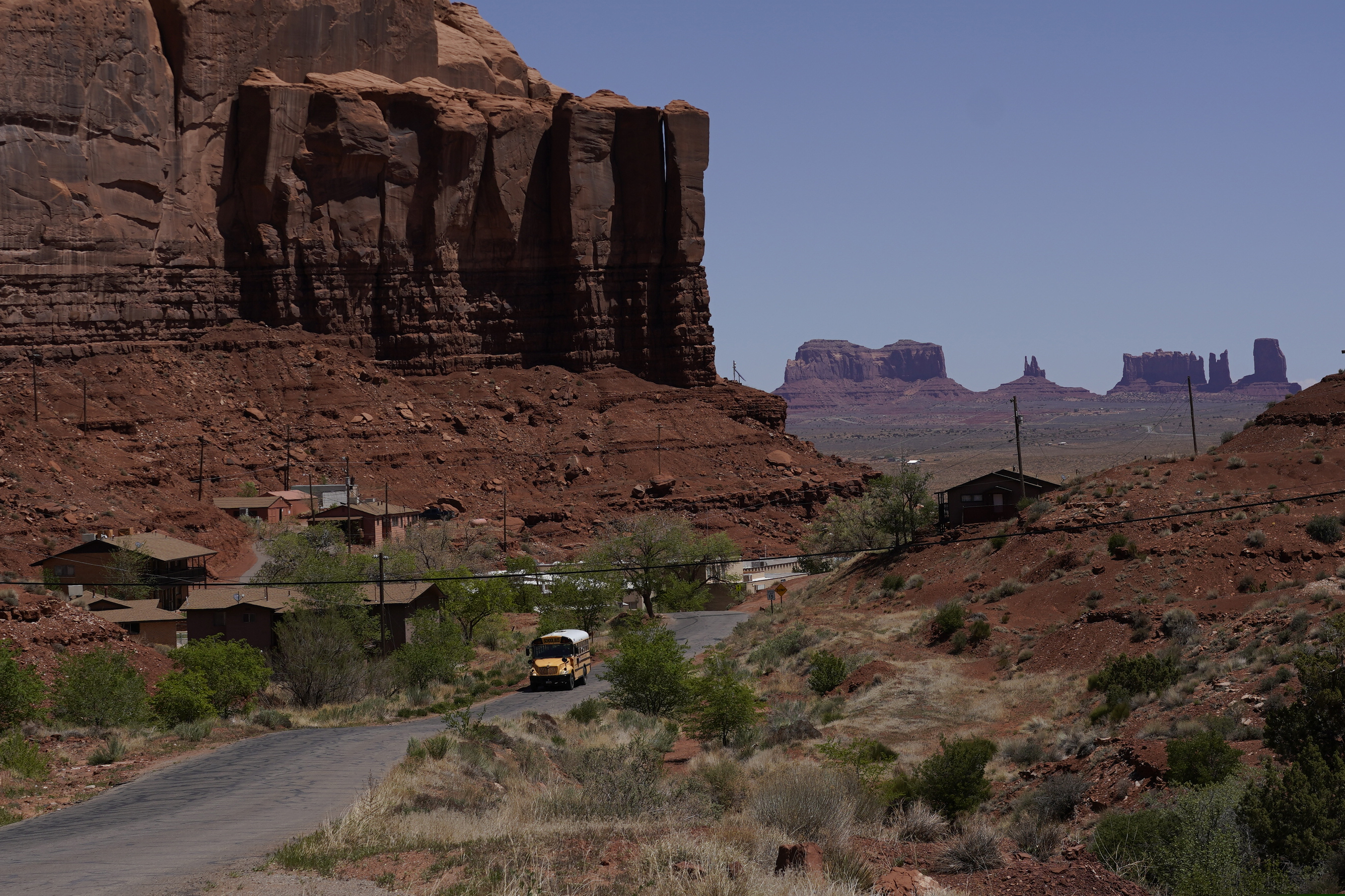 (Carolyn Kaster | AP) A school bus is driven through Oljato-Monument Valley, Utah, on the Navajo reservation. Even before the pandemic, people living in rural communities and on reservations were among the toughest groups to count in the 2020 census.