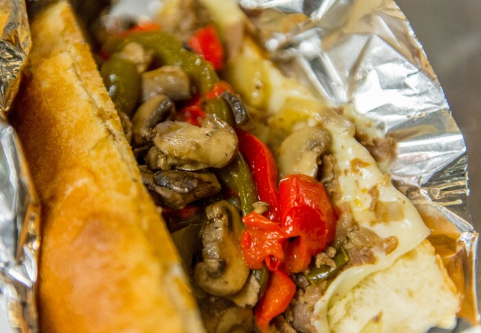 (Trent Nelson  |  Tribune File Photo)  A loaded Authentic Philly Cheesesteak at Moochie's Meatballs in Midvale.