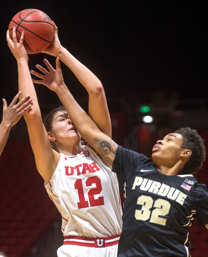 (Rick Egan  |  The Salt Lake Tribune) Utah Utes forward Emily Potter (12) goes up for a shot as Purdue Boilermakers forward Ae'Rianna Harris (32) defends, in basketball action Utah Utes vs. Purdue Boilermakers, at the Jon M. Huntsman Center, Monday, November 20, 2017.