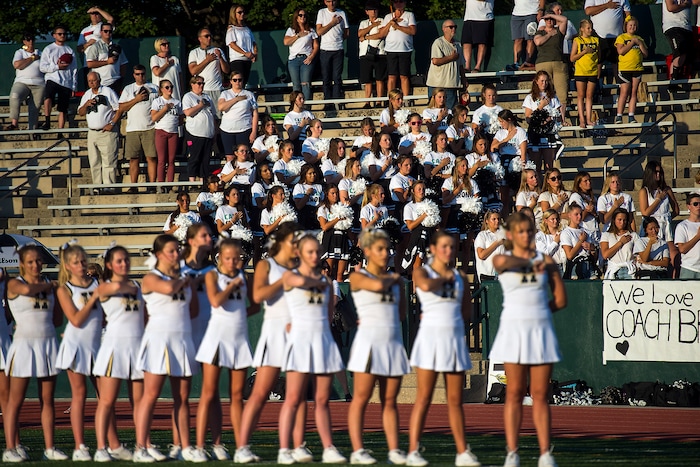(Chris Detrick  |  The Salt Lake Tribune)    Hillcrest students and parents listen to the National Anthem before the game at Hillcrest High School Friday, September 1, 2017. Cazzie Brown passed away Sunday night after spending four days in the hospital. According to a family representative, Brown was brought to the emergency room Wednesday for complications with his thyroid. The doctors found that he had contracted meningitis, and later received a preliminary positive after being tested for West Nile virus. 