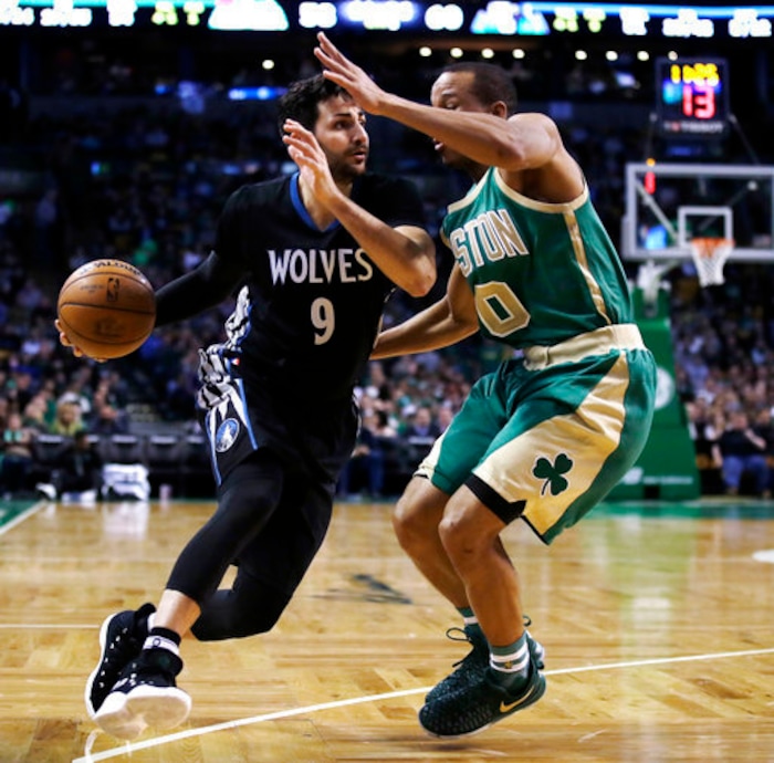 FILE - In this March 15, 2017, file photo, Minnesota Timberwolves' Ricky Rubio (9) tries to drive past Boston Celtics' Avery Bradley (0) during the second half of an NBA basketball game in Boston. The Timberwolves have reached an agreement to Rubio to the Utah Jazz to clear salary cap space for a big run in free agency. A person with direct knowledge of the deal tells The Associated Press the two sides agreed to the move on Friday, June 30, 2017, hours before free agency opened. (AP Photo/Charles Krupa, File)