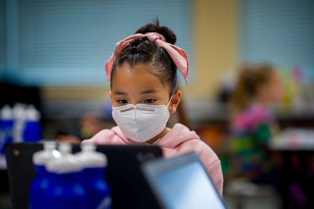 (Trent Nelson | The Salt Lake Tribune) Students wearing masks work on computers in a second grade class at Neil Armstrong Academy in West Valley City on Tuesday, Sept. 28, 2021. Many families have elected to continue with all-online learning this school year.