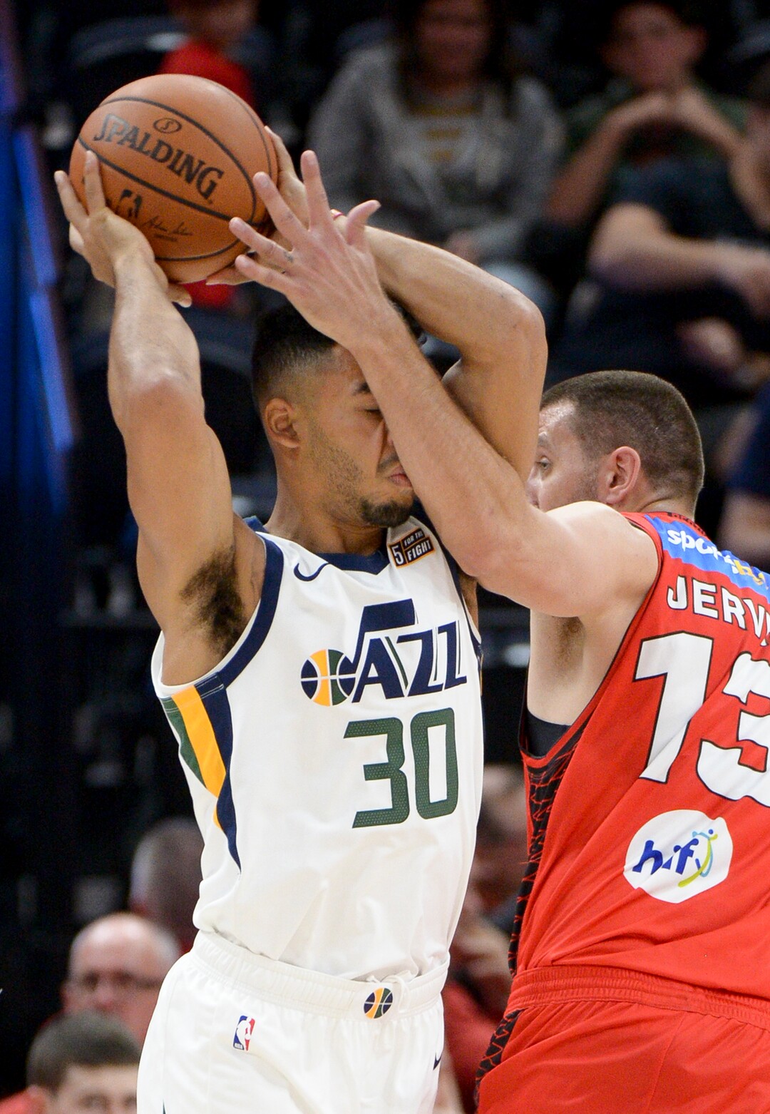 Leah Hogsten  |  The Salt Lake Tribune   Utah Jazz guard Naz Mitrou-Long (30) feels the forearm of Perth Wildcats center Tom Jarvis (13) while looking to make a pass as the Utah Jazz defeated the Perth Wildcats, Sept. 29, 2018 130-72 at Vivint Smart Home Arena. 