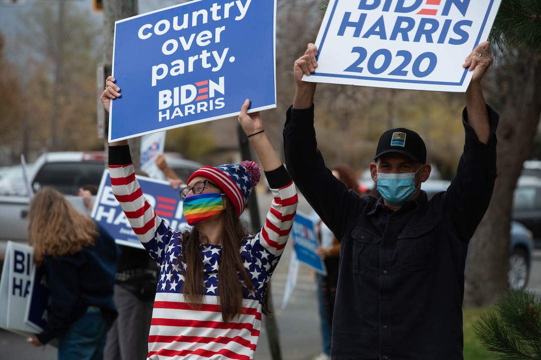 (Francisco Kjolseth  |  The Salt Lake Tribune) Jamie and Brandon Dansie join supporters of President-elect Joe Biden as they celebrate at Liberty Park on Saturday, Nov. 7, 2020, in Salt Lake City.