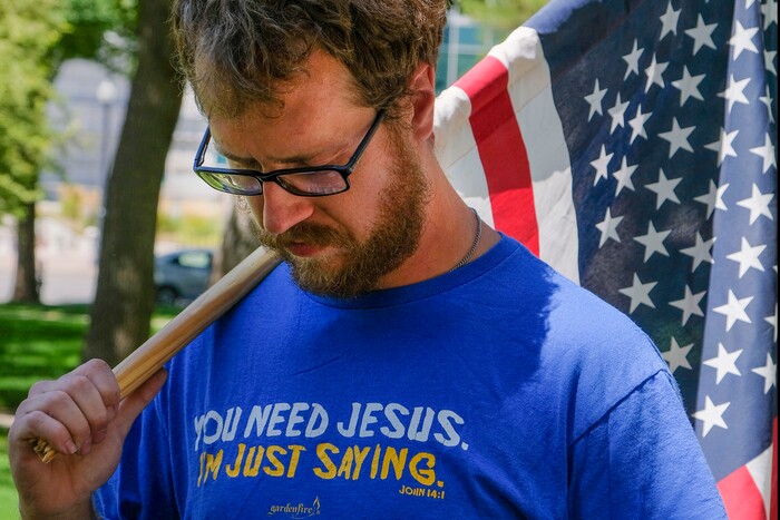 (Leah Hogsten | The Salt Lake Tribune) Colton Welch pauses during a moment of silence in support of officers who lost their lives in the line of duty at a Back the Blue rally in support of law enforcement, Saturday, August 15, 2020 at Washington Square.