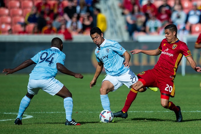 (Chris Detrick  |  The Salt Lake Tribune)  Real Salt Lake midfielder Luis Silva (20) Sporting Kansas City midfielder Roger Espinoza (27) and Sporting Kansas City midfielder Jimmy Medranda (94) go for the ball during the game at Rio Tinto Stadium Sunday, October 22, 2017.  