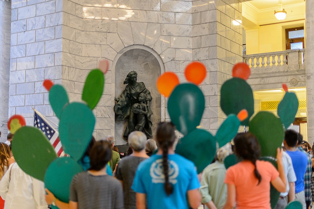 (Trent Nelson | The Salt Lake Tribune)  A statue dedicated to Immigration and Settlement stands over a rally at the State Capitol building in Salt Lake City to "remind Senator Hatch and Senator Lee that DACA is #HereToStay, Thursday August 31, 2017.
