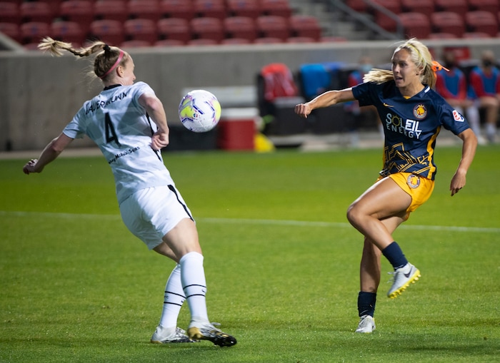 (Rick Egan | The Salt Lake Tribune) Utah Royals FC forward Brittany Ratcliffe (25) bounces the ball off Portland Thorns FC defender Becky Sauerbrunn (4), in soccer action between Utah Royals FC and Portland Thorns FC at Rio Tinto Stadium, on Saturday, Oct. 3, 2020.