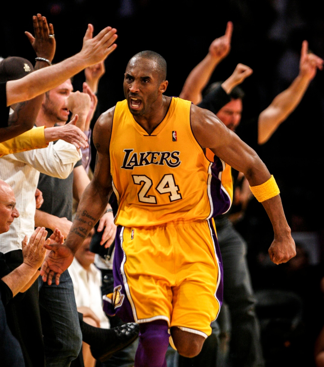 (Trent Nelson  |  The Salt Lake Tribune) Kobe Bryant high-fives fans, Utah Jazz vs. Los Angeles Lakers basketball, game two NBA playoffs, Tuesday April 21, 2009 at the Staples Center.