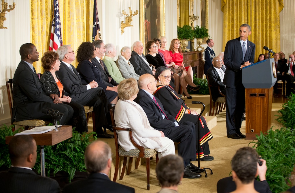 President Barack Obama, right, speaks before awarding the Presidential Medal of Freedom, Monday, Nov. 24, 2014, during a ceremony in the East Room of the White House in Washington. President Obama is presenting the nation's highest civilian honor to 19 artists, activists, public servants and others. (AP Photo/Pablo Martinez Monsivais)