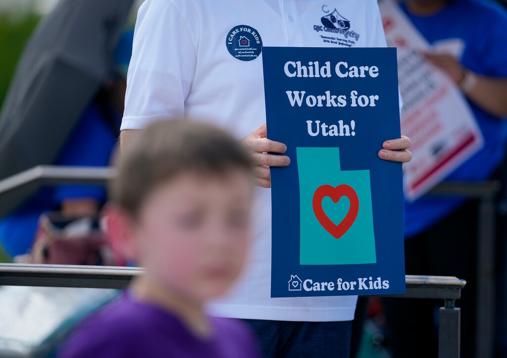 (Bethany Baker  |  The Salt Lake Tribune) An attendee holds up a sign during a May 2024 rally to demand funding for child care at the Utah Capitol. Tribune guest columnist Rebbie Brassfield has her own ideas for plugging the day care gap.