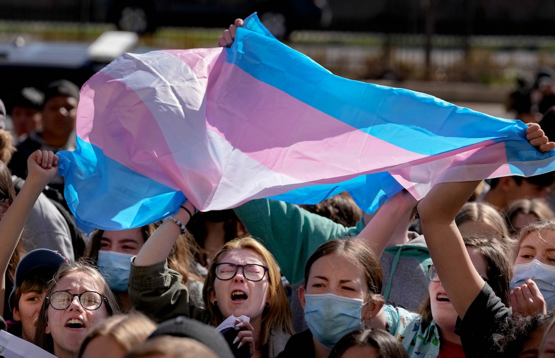 (Francisco Kjolseth | The Salt Lake Tribune) West High School students chant “trans youth are valid!” as they wave a transgender flag during a staged walkout on Wednesday, April 6, 2022 to protest HB11, which bans transgender girls from participating in female school sports.