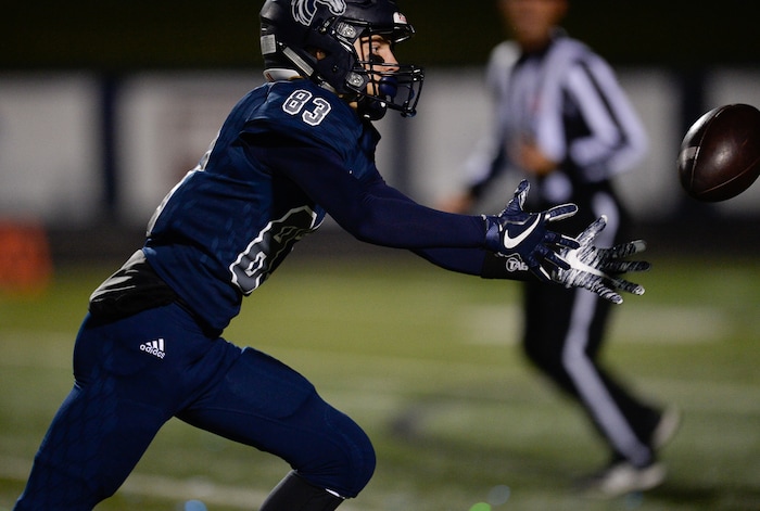 (Francisco Kjolseth  |  The Salt Lake Tribune) JT Cutrer of Corner Canyon loses control of a pass in game action between Timpview at Corner Canyon on Thursday, Sept. 21, 2017.