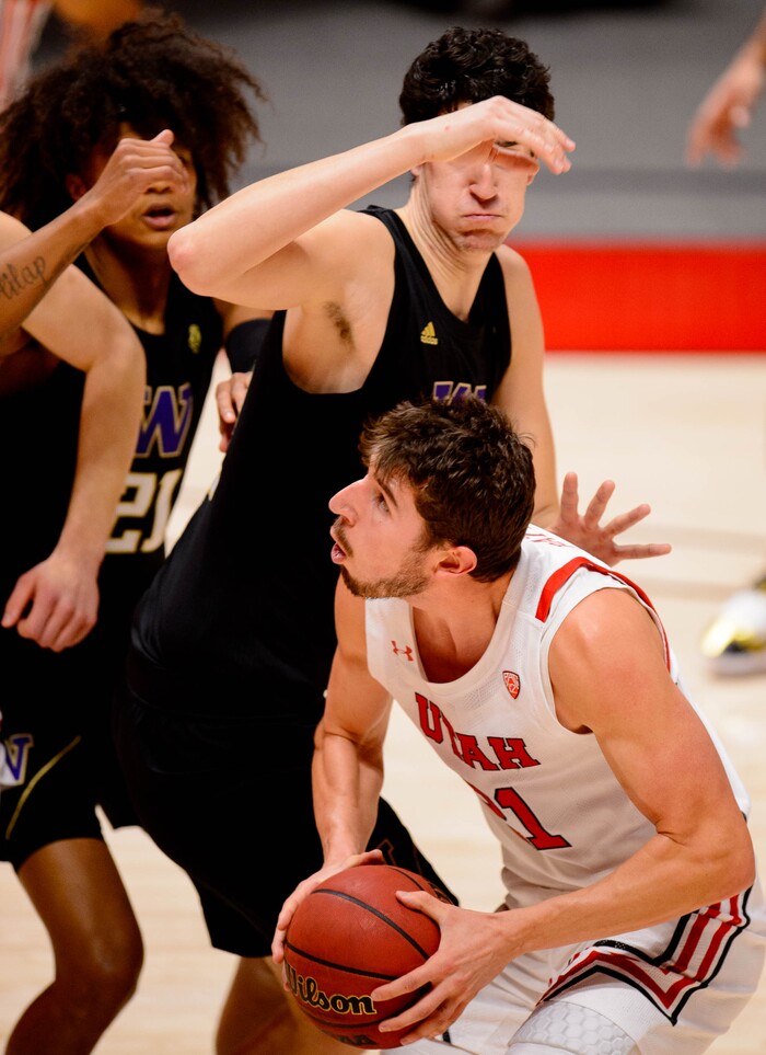(Trent Nelson | The Salt Lake Tribune) Utah's Riley Battin is defended by Washington's Riley Sorn as Utah hosts Washington, NCAA basketball in Salt Lake City on Thursday, Dec. 3, 2020.