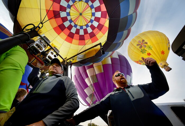 (Scott Sommerdorf | The Salt Lake Tribune)
Captain Greg Lindsey of Safford, Arizona, left, prepares to get his "Just Ducky" balloon aloft at the 4th annual Autumn Aloft Hot Air Balloon Festival in Park City, Sunday, September 17, 2017.