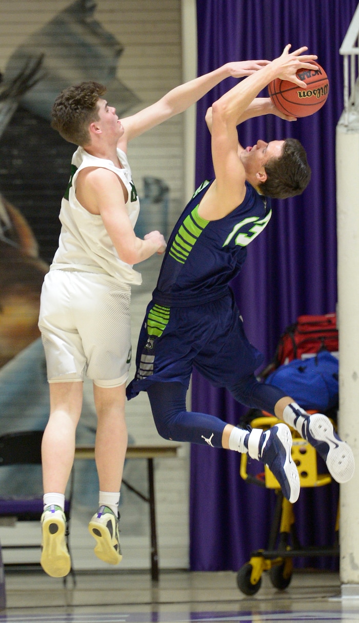 Leah Hogsten  |  The Salt Lake TribuneOlympus' Harrison Creer fouls Timpanogos' Conner Halford. Olympus High School defeated Timpanogos High School 91-69 during their 4A State boys’ basketball quarterfinal playoff game at Weber State University's Dee Events Center, Thursday, March 2, 2017.