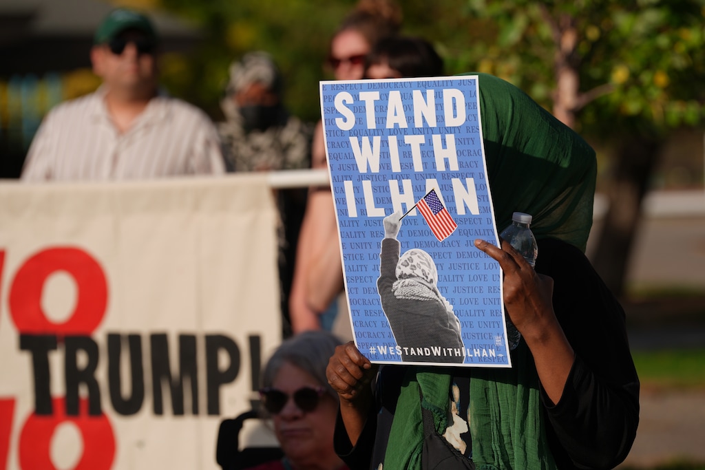 Community members rally in support of Democratic Rep. Ilhan Omar, D-Minn., Monday, Oct. 12, 2026, at Powderhorn Park in Minneapolis. (AP Photo/Ellen Schmidt)
