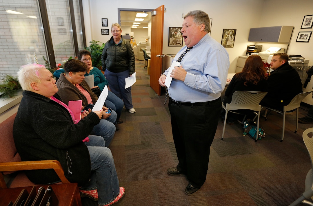 Utah County Clerk and Auditor Bryan Thompson hands out rejection letters for a marriage license to Raylynn Marvel left, Patsy Carter, 2nd left, from Orem, Utah, Loreen Major 2nd right, and Arlene Arnold right, from Lehi, Utah in the offices of the Utah County Clerk and Auditor office on July 20, 2013 in Provo, Utah. A Federal Judge on Friday struck down Utah's ban on same sex marriage saying the law violates the U.S. Constitution.  (Photo by George Frey  |  Special to the Tribune)