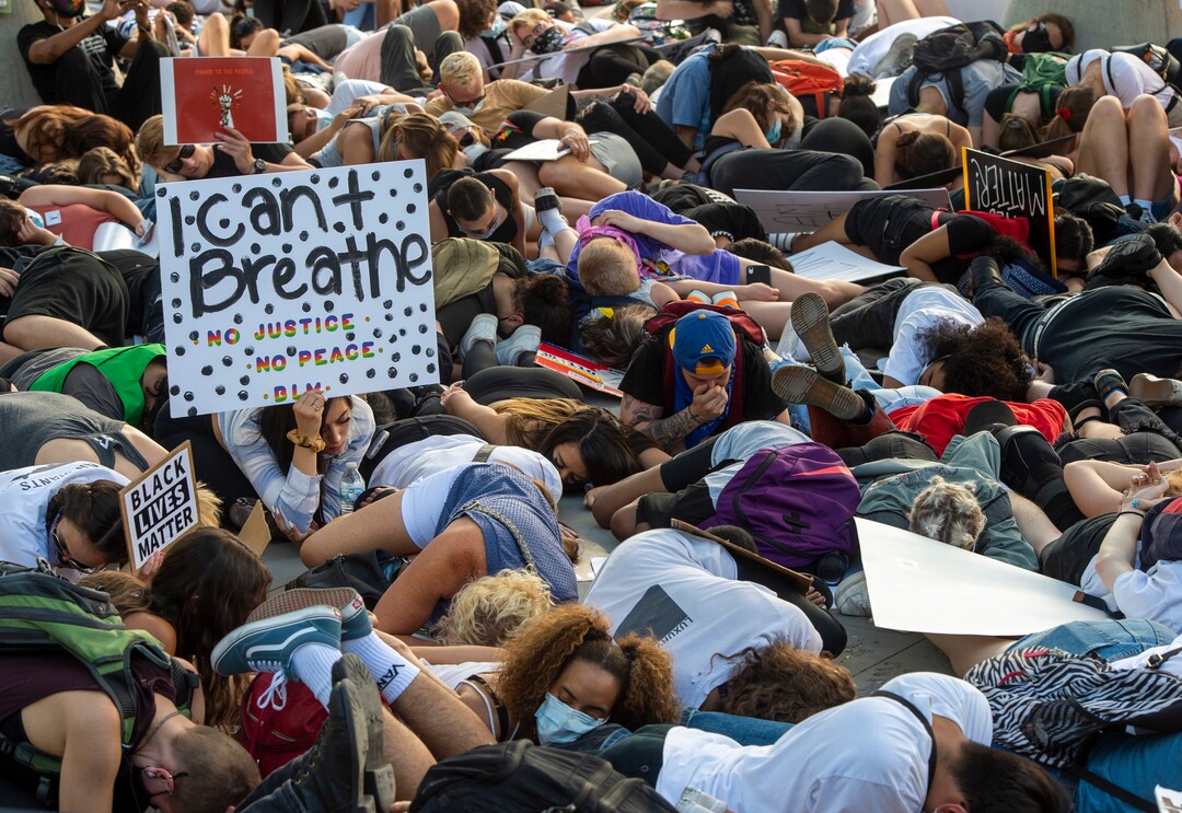 (Rick Egan  |  The Salt Lake Tribune)     Protesters lie down in silence for 9 minutes in memory of George Floyd, during a demonstration at the Public Safety Building, Wednesday, June 3, 2020.