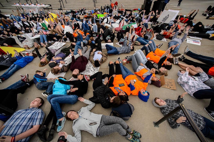 (Trent Nelson | The Salt Lake Tribune)  
High school students staged a die-in at the Utah State Capitol in Salt Lake City to mark the anniversary of the Columbine High School massacre and call for action against gun violence, Friday April 20, 2018.