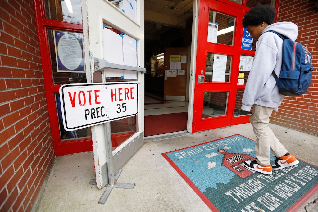 (AP Photo/Rogelio V. Solis)

A Spann Elementary School student looks over the "Vote Here" sign at the entrance to his school, Tuesday, Nov. 5, 2019, in Jackson, Miss.