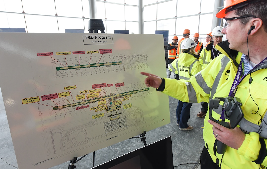 (Francisco Kjolseth  |  The Salt Lake Tribune)  Jasen Asay, Public Relations Manager for Salt Lake City International Airport overlooks the map with Concourse A and B with the placement of new food concessionaires during a tour on Wed. Feb. 20, 2019.