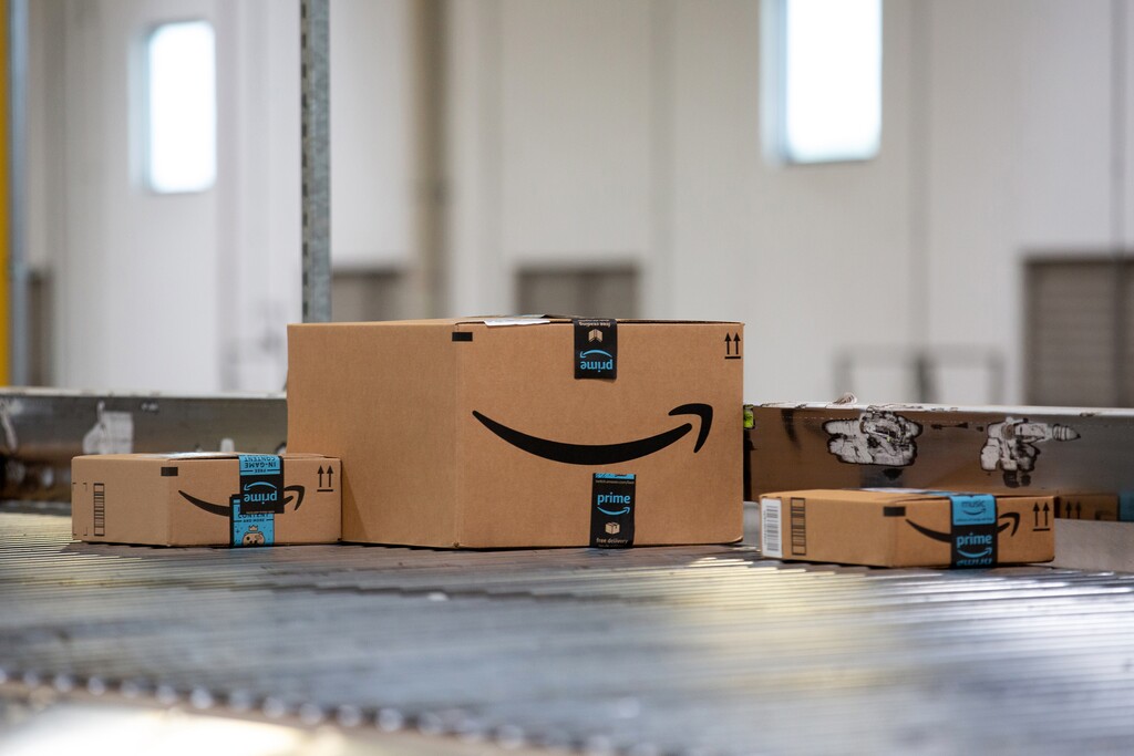 (Bess Adler | Bloomberg) Packages move along a conveyor belt at the Amazon.com Inc. fulfillment center in Robbinsville, N.J., on June 7.